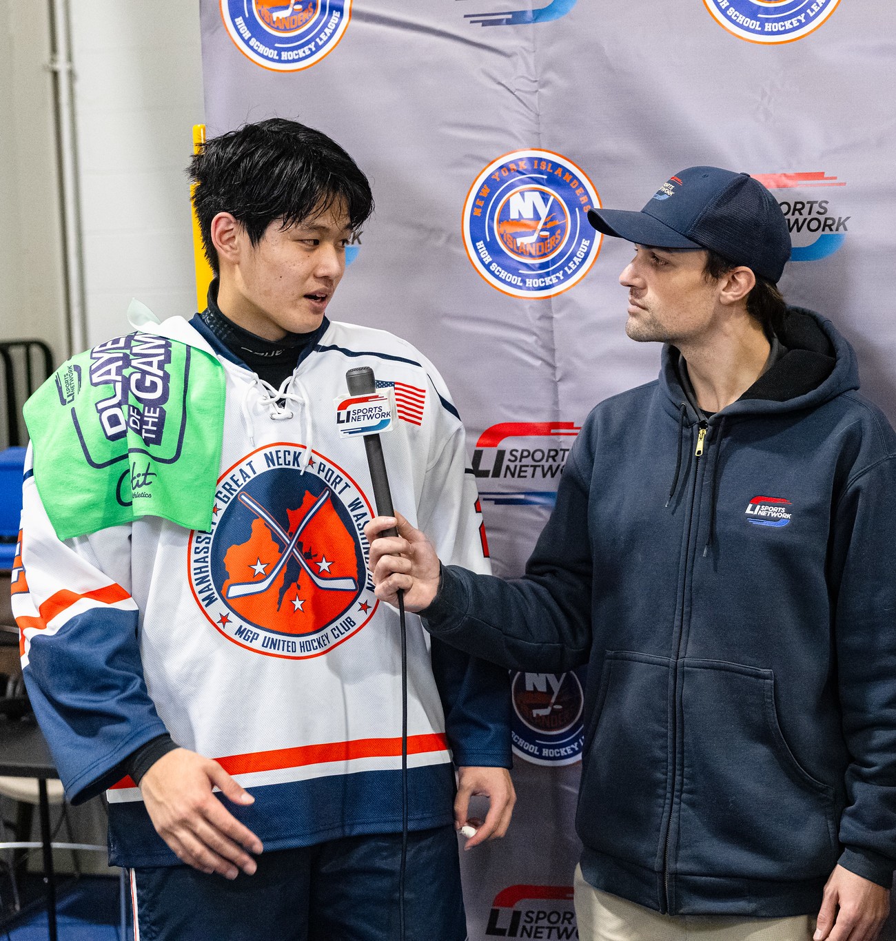 Travis Quigley interviewing a player after a game
